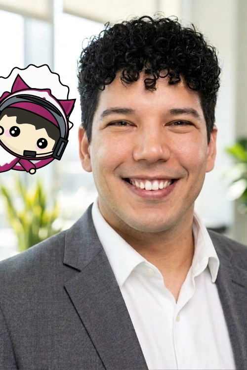 Portrait of a smiling team member in a gray blazer