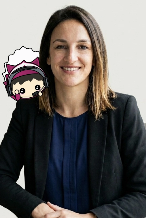 Portrait of a smiling team member in a dark blazer